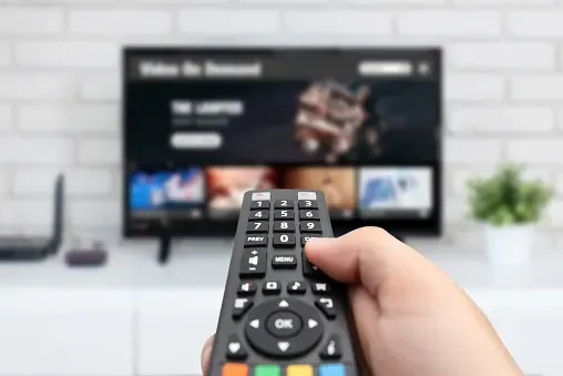 Man using the remote control in hand.