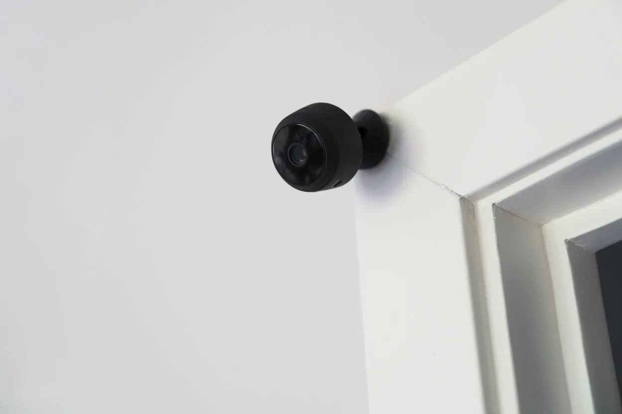 CCTV camera mounted on a doorframe