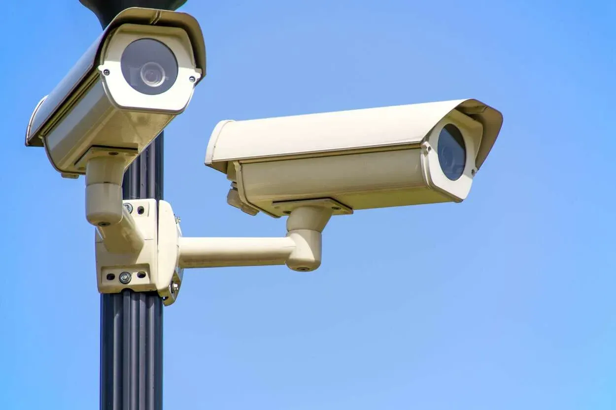 Security cameras attached on a post