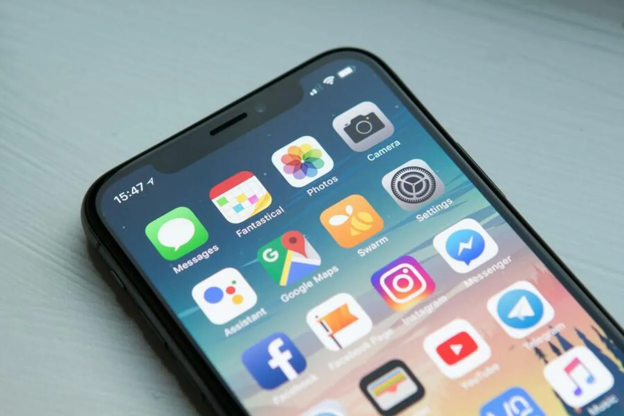 Space grey iPhone X with a bunch of apps