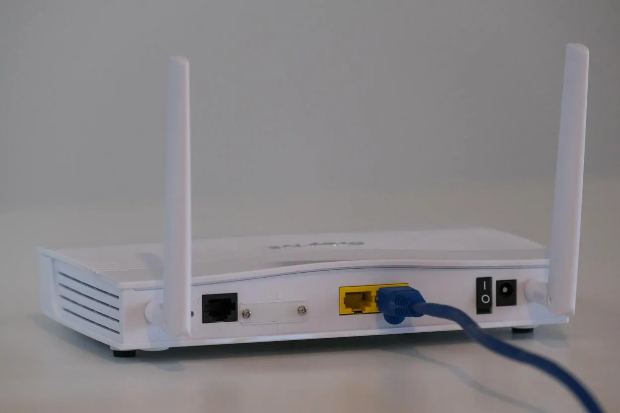 A simple router with a power cable connected to it