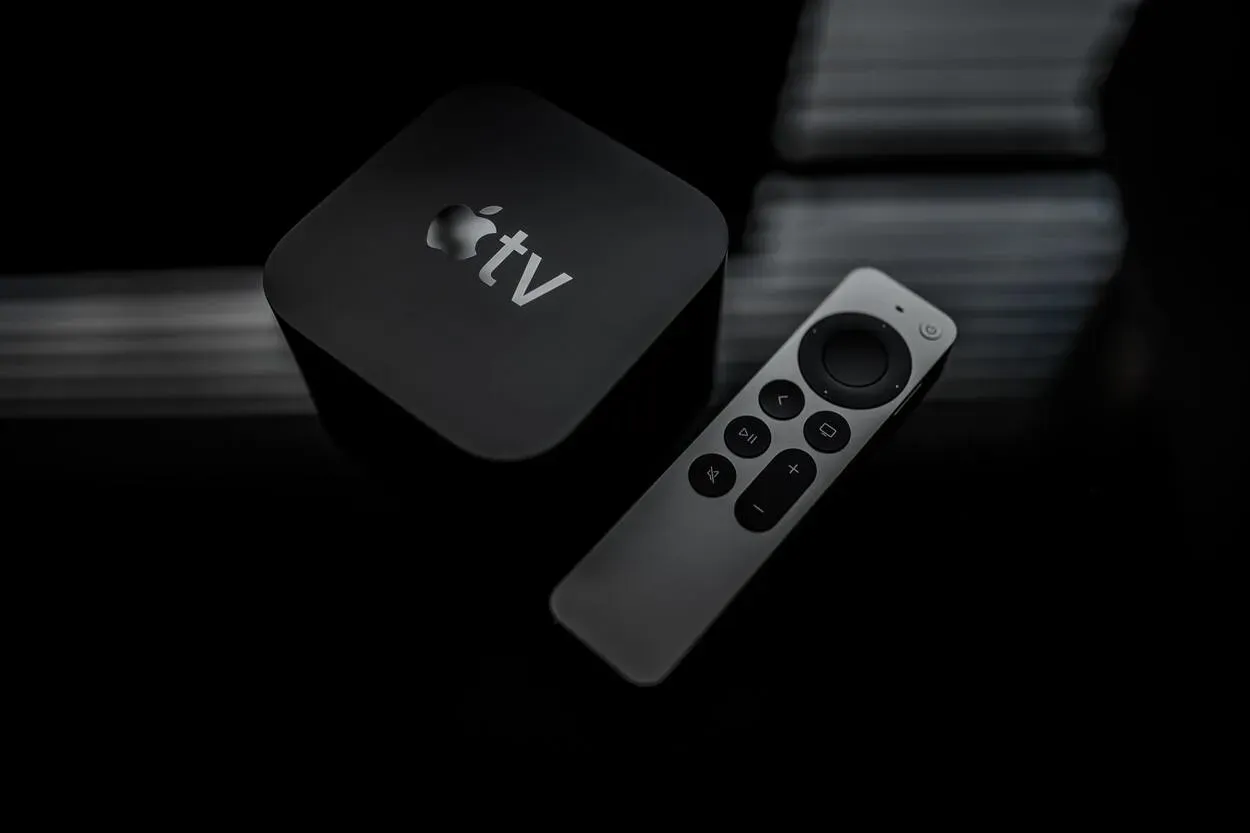 An Apple TV with its remote